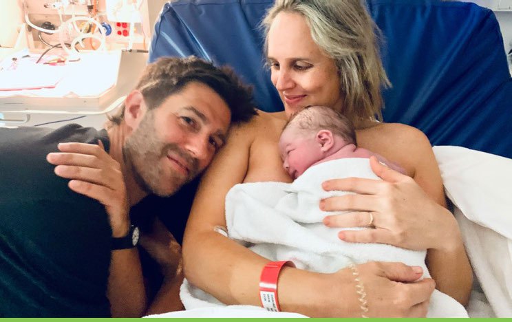 Monty Dimond holding baby